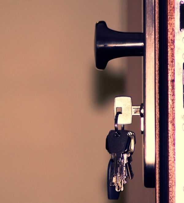 Detailed view of a door lock and keys emphasizing security and access.
